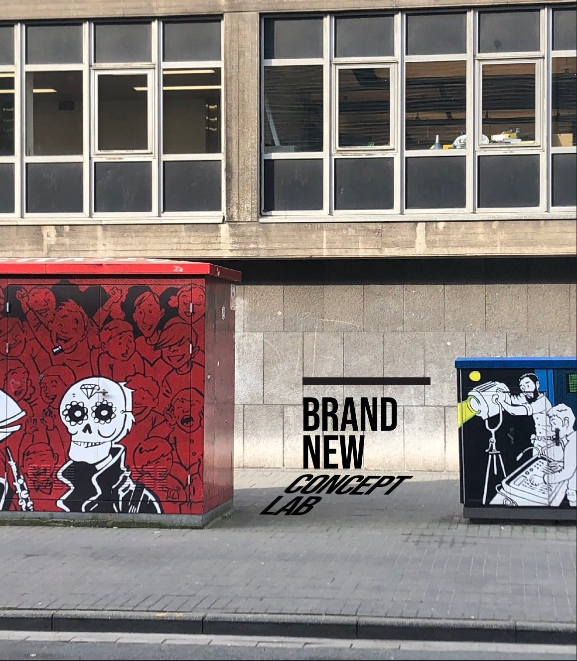 BNCL branded street furniture — the studio's painted wordmark on utility boxes outside the office