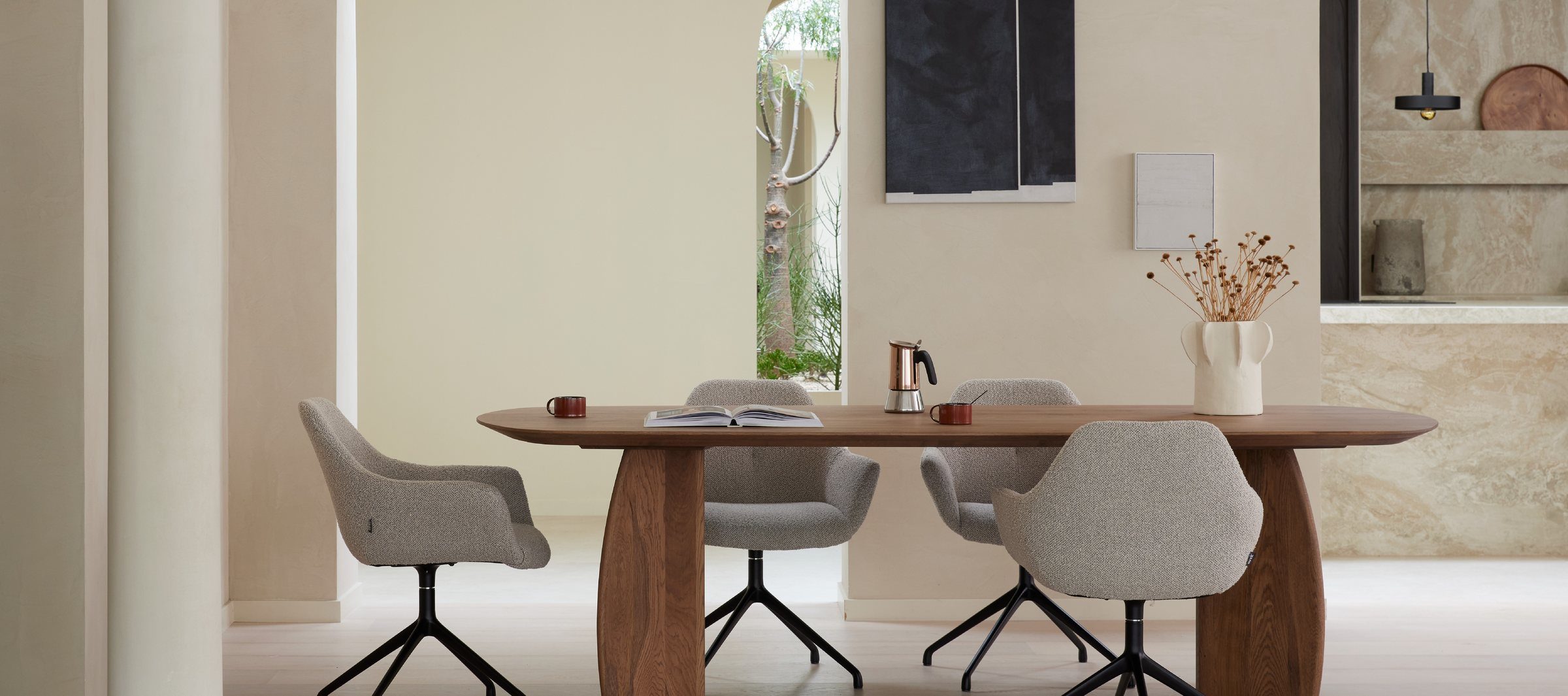 A Dyyk oak dining table and chairs styled with everyday objects