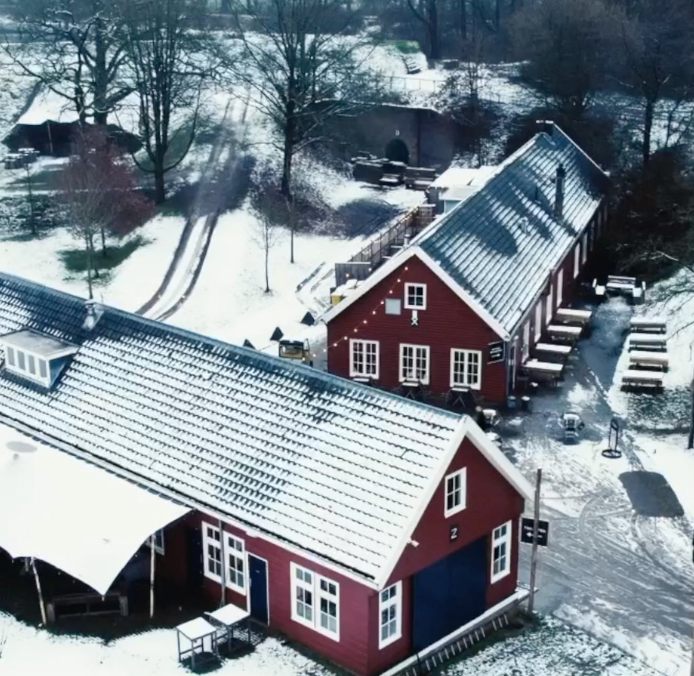 Aerial view of the fort's red timber barracks and bunkers