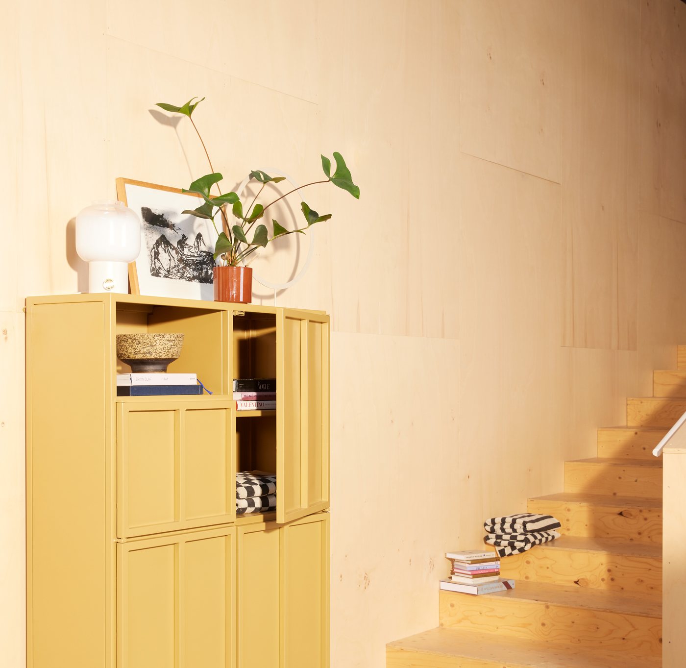 A New Routz cabinet from the New Heritage collection, styled beneath a staircase